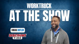 Chase Loyd of FASTER Asset Solutions smiling at the Work Truck At The Show booth, discussing fleet management software, public fleet challenges, and tools that reduce downtime.