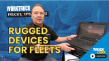 Man working on a laptop with logos for Work Truck and Truck Chat and large yellow headline Rugged Devices for Fleets.