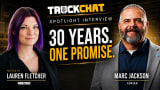 Promotional graphic for a TruckChat spotlight interview featuring Lauren Fletcher of Work Truck and Marc Jackson of Adrian. The image shows Lauren Fletcher on the left and Marc Jackson on the right against a dark industrial warehouse background. Large text reads “30 Years. One Promise.” with TruckChat branding above and “Spotlight Interview.” Lauren Fletcher is identified as the host, and Marc Jackson is identified with Adrian.