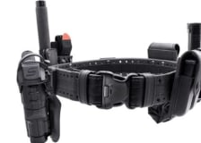 A close up of a police holster with assorted pockets for officers' equipment.