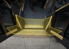 An image of a doorway on a public transit vehicle with a yellow outline overlay.