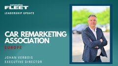 Johan Verbois, executive director of CARA, stands outdoors in a blue blazer with arms crossed, with blurred vehicles and greenery in the background.