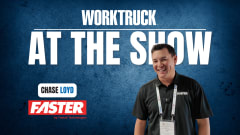Chase Loyd of FASTER Asset Solutions stands on the show floor during Work Truck At The Show, discussing public fleet data, downtime, and funding challenges.