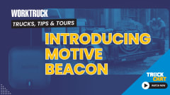 Faint background image of a construction truck and lower left a small black box with a blue light, logos for Work Truck and Truck Chat, and headline Motive Beacon: Helping Fleets Track Assets.