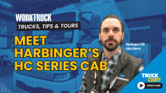 Man standing in front of an image of a blue-tinted box truck with logos for Work Truck and Truck Chat, and a yellow headline, Meet Harbinger's HC Series Cab.