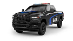 Black Ram police pickup truck against a white background.
