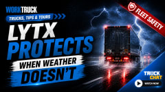 A dramatic YouTube thumbnail showing a semi-truck driving through heavy rain and lightning on a dark highway, with bold text reading “LYTX Protects When Weather Doesn’t.” The Work Truck logo appears in the corner, along with a red “Fleet Safety” banner.