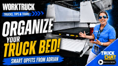 Work Truck "Trucks, Tips & Tours" thumbnail featuring an Adrian representative demonstrating an organized pickup truck bed with smart storage upfits. Headline reads, "Organize Your Truck Bed!" with Truck Chat branding and a "Watch Now" callout.