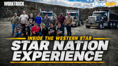 Group of Western Star Star Nation participants posing in front of heavy-duty trucks at a quarry, with the text “Inside the Western Star Star Nation Experience.”