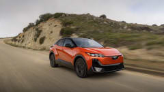 A 2027 red subaru uncharted drives down a road