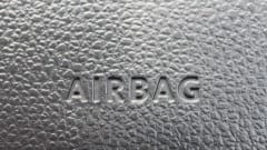 Closeup photo of 'airbag' stamp on a car dash