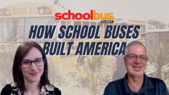 Thumbnail for a School Bus Fleet video titled "How School Buses Built America." The image features Amanda Huggett and school bus expert Brad Beauchamp in front of a faded background showing vintage yellow school buses. The School Bus Fleet logo appears above the title.