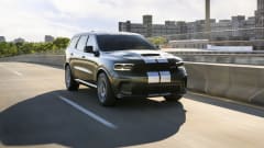Photo of Dodge Durango moving down a road in sunlight