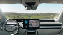 Interior dashboard view of a Volvo EV featuring Google Maps navigation and infotainment display during a demo of upcoming Gemini AI vehicle integration.