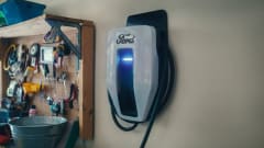 Photo of wall-mounted Ford electric-vehicle charger in a home