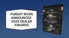 Graphic announcing Forest River Bus & Van’s 2025 Top Dealer awards alongside a plaque recognizing The Bus Center as a Top 4 Dealer of the Year for sales performance and customer service.