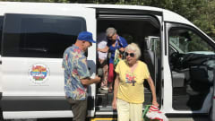 Seniors exiting an OCTA van.