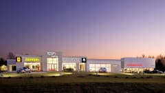 Foreign Cars Italia dealership store in front of sunset