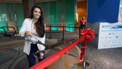Nichole Osinski at GFX showcase floor ribbon cutting