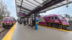 Two MBTA railcars in station.