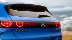 Photo of the rear of a Mercedes GLC 400 electric SUV with a skyline in the background