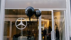 Photo of the facade of one of Mercedes' new city studios, with a vehicle displayed in the window
