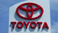 red Toyota name and logo on white building