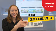 Charlotte Argue of Geotab speaks at ACT Expo, gesturing toward a display of telematics and camera technology. Text overlay reads “Geotab: Data Drives Safety.”