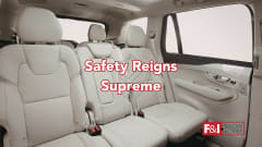back seat of an SUV, cream colored leather, text Safety Reigns Supreme, F&I and Showroom logo