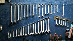 Photo of metal tools lined up in rows on a surface