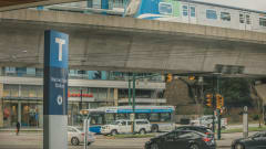 A TransLink bus and rail line in operation. 