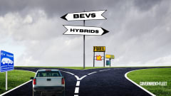 A graphic of a divided road and bev signs. 