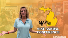 Thumbnail for a School Bus Fleet video featuring MAPT Executive Director Katrina Morris standing with her arms open in front of a blurred trade show floor at the 61st Annual Michigan Association for Pupil Transportation (MAPT) Conference. A yellow outline of the state of Michigan and the text "MAPT 61st Annual Conference" appear beside her, with the School Bus Fleet logo in the lower-right corner.