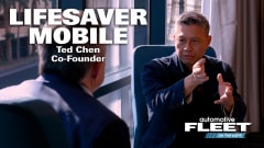 Chris Brown sits across from safety experft at Lifesaver mobile in an interview about distracted driving and phone use tech.