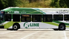 A green and white Rhode Island Public Transit Authority electric bus.