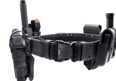 A close up of a police holster with assorted pockets for officers' equipment.