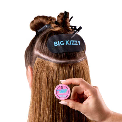 Model demonstrating the one sided tape roll in hair