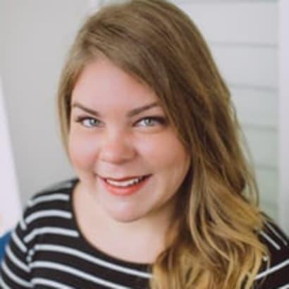 Former salon owner Jena Berenberg smiles into the camera.