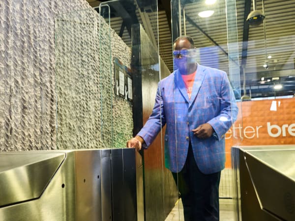 MARTA Interim General Manager and CEO Jonathan Hunt is the first customer to tap to pay at the new better Breeze faregates at Lindbergh Center Station.