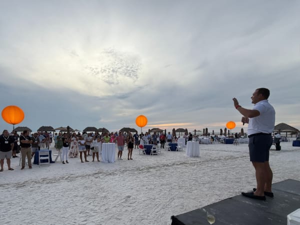 Nick Verceles, SVP, Head of North American Sales at Element, addresses the crowd at beach reception. 