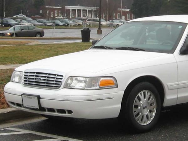 A white Ford Crown Vistoria