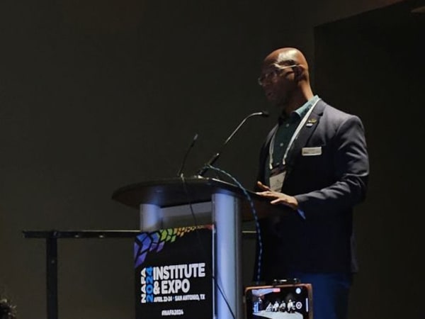 Al Curtis, fleet management director for Cobb County, Georgia, moderates on stage at NAFA I&E 2024. 