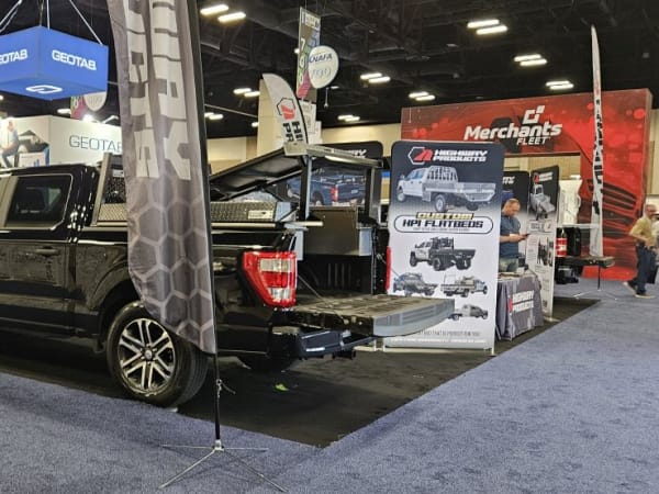 A black pickup truck with Highway Products upfit. 