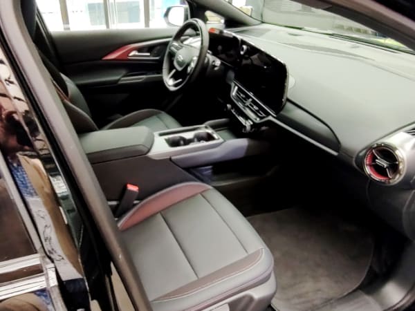 View in through open door on passenger side of small SUV.
