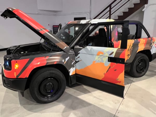 Slate SUV on exhibit floor with all doors and windows open.