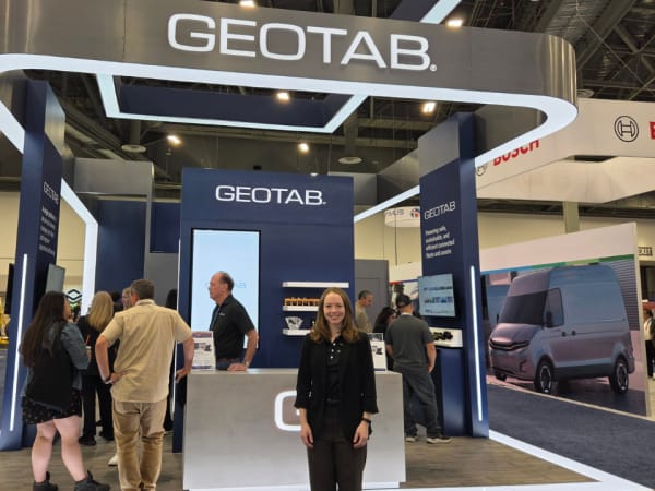 Charlotte Argue poses at the Geotab booth highlighting connected fleet management and telematics solutions at ACT Expo 2026.