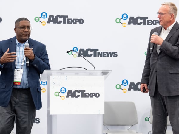 Steve Whaley of Blue Bird and Anthony Jackson of Bibb County School District speak during an ACT Expo session on managing mixed-energy school bus fleets.