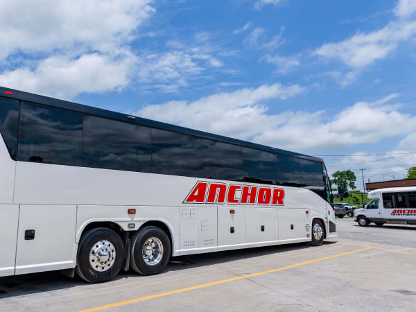 Anchor motorcoach with mid-size bus