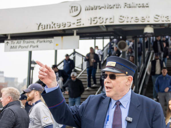 Metro-North conductor Steve Boland greeted arriving fans with a medley of songs, including “Take Me Out to the Ball Game."