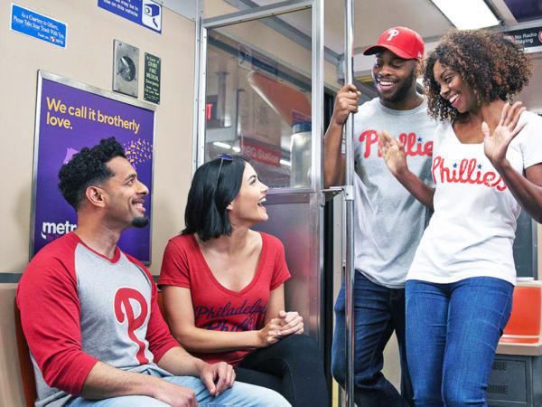 Four Philadelphia Phillies fans on a SEPTA train.